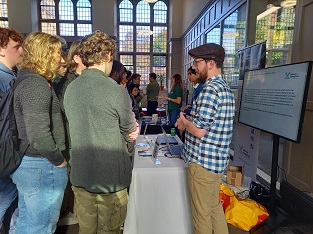 Students at Maths at work event 25 Oct 2023 talking to Malvern Panalytical
